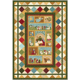 A festive Christmas quilt featuring nativity scenes and holiday imagery surrounded by colorful diamond-patterned borders in earth tones.