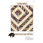 A quilt pattern featuring large star blocks in cream backgrounds with brown, burgundy, and green log cabin centers arranged in a geometric design.