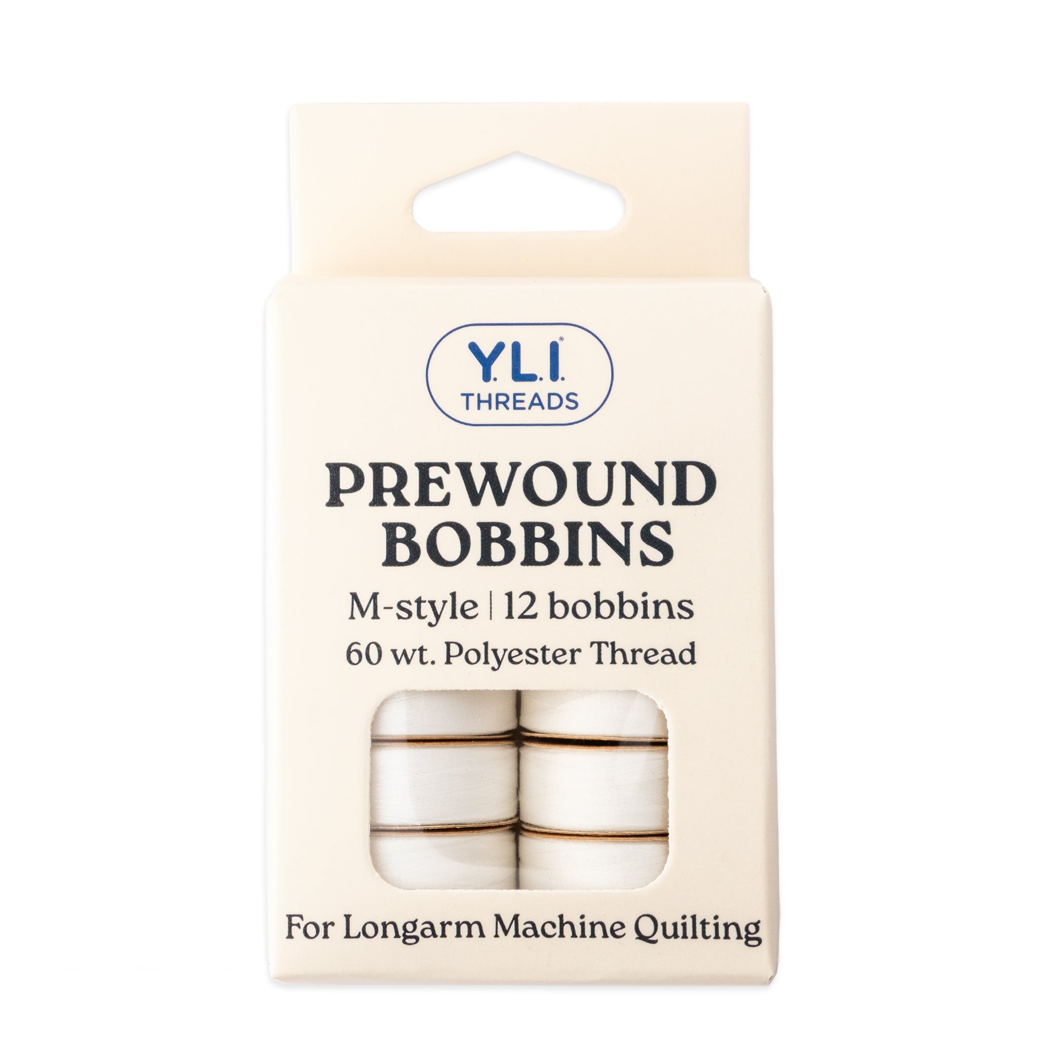 White M-style prewound bobbins for longarm quilting