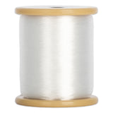 Clear invisible nylon thread wound on wooden spool with natural wood flanges
