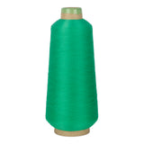Green spool of yarn on a white background