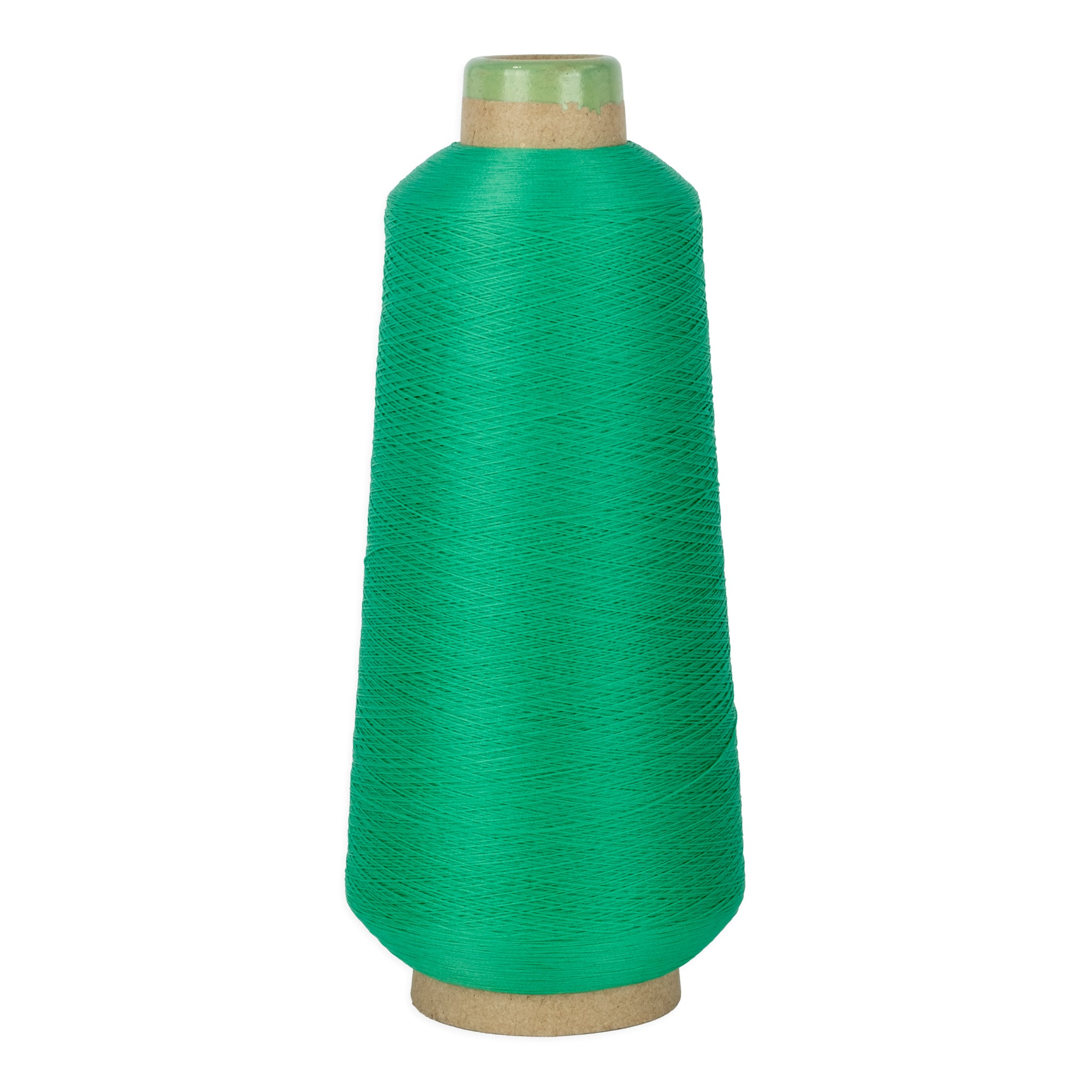 Green spool of yarn on a white background