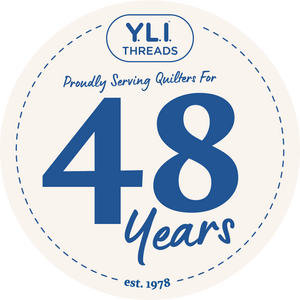 Y.L.I. Threads logo celebrating 48 years of service to quilters, with a blue and white color scheme.